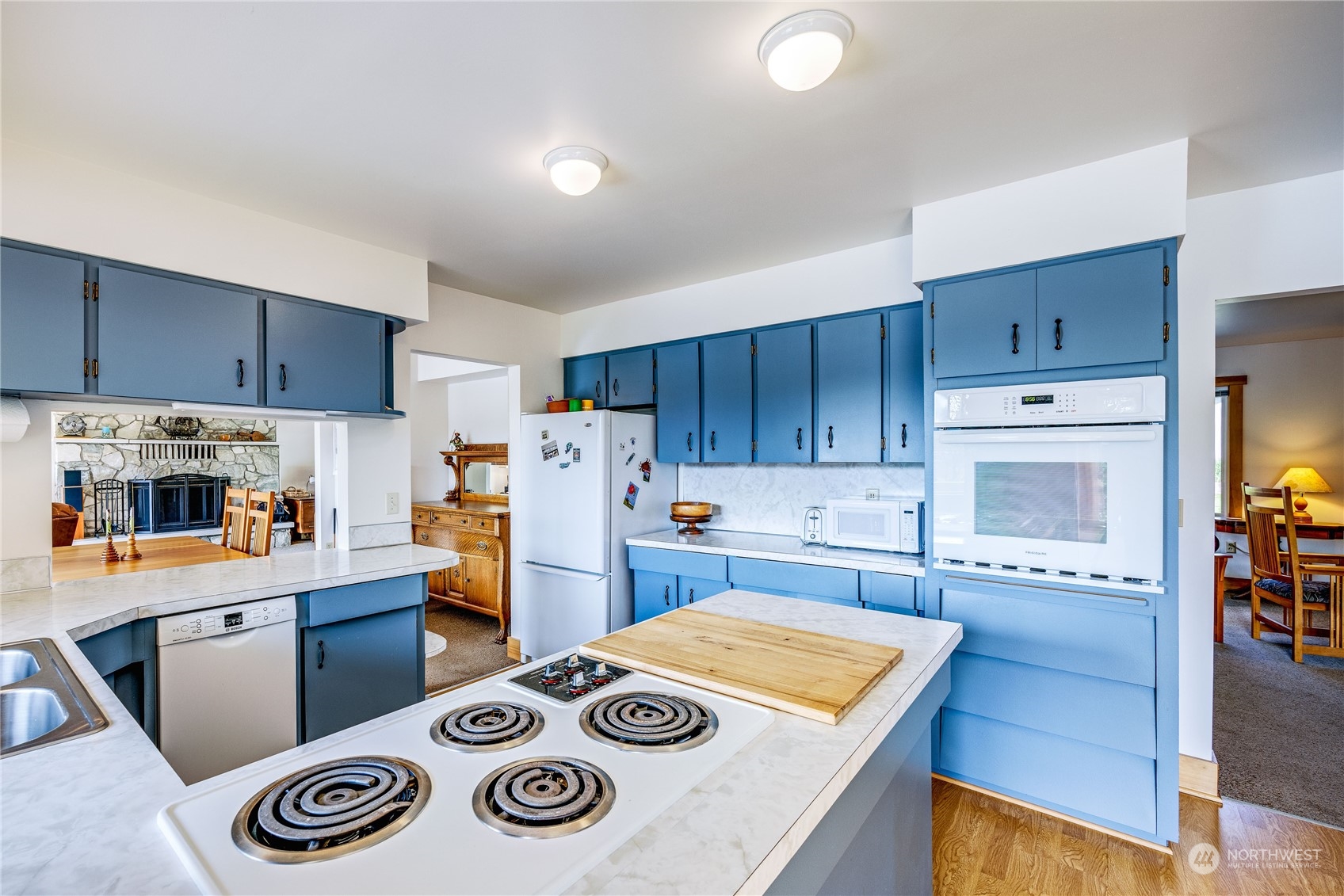 1511 Griffith Point Road Nordland, WA 98358 - Photo 16 of 40 a kitchen with a stove a refrigerator and a stove