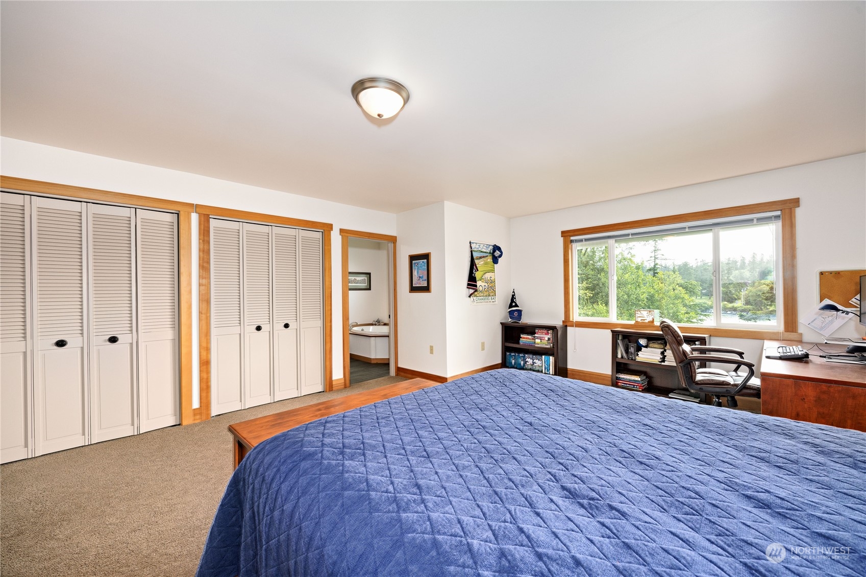 1511 Griffith Point Road Nordland, WA 98358 - Photo 18 of 40 a bed room with a bed and a large window