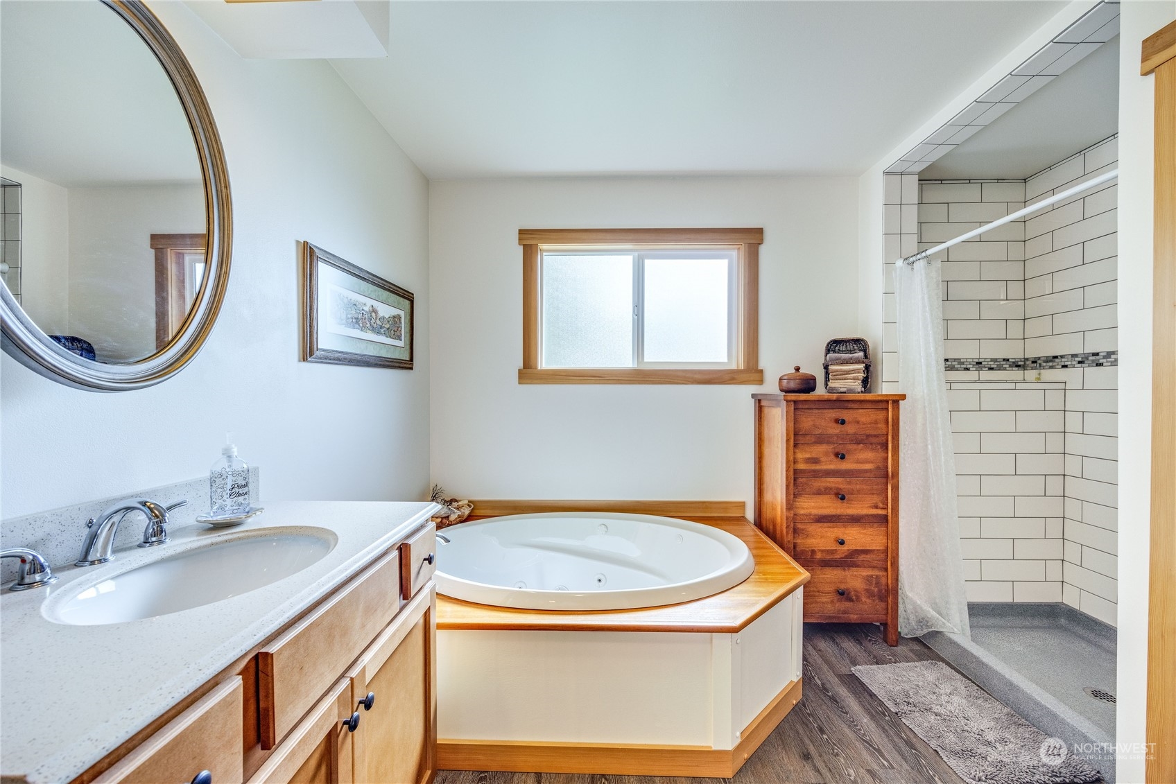 1511 Griffith Point Road Nordland, WA 98358 - Photo 19 of 40 a bathroom with a sink a toilet and a mirror