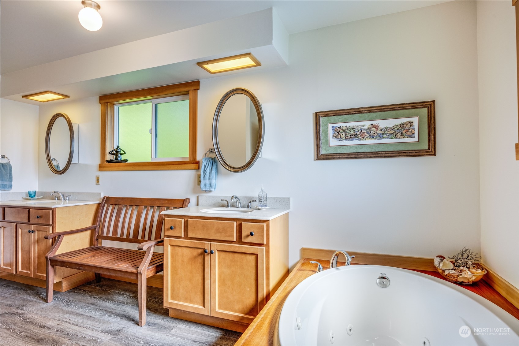 1511 Griffith Point Road Nordland, WA 98358 - Photo 20 of 40 a view of a room that has a bed and a chandelier