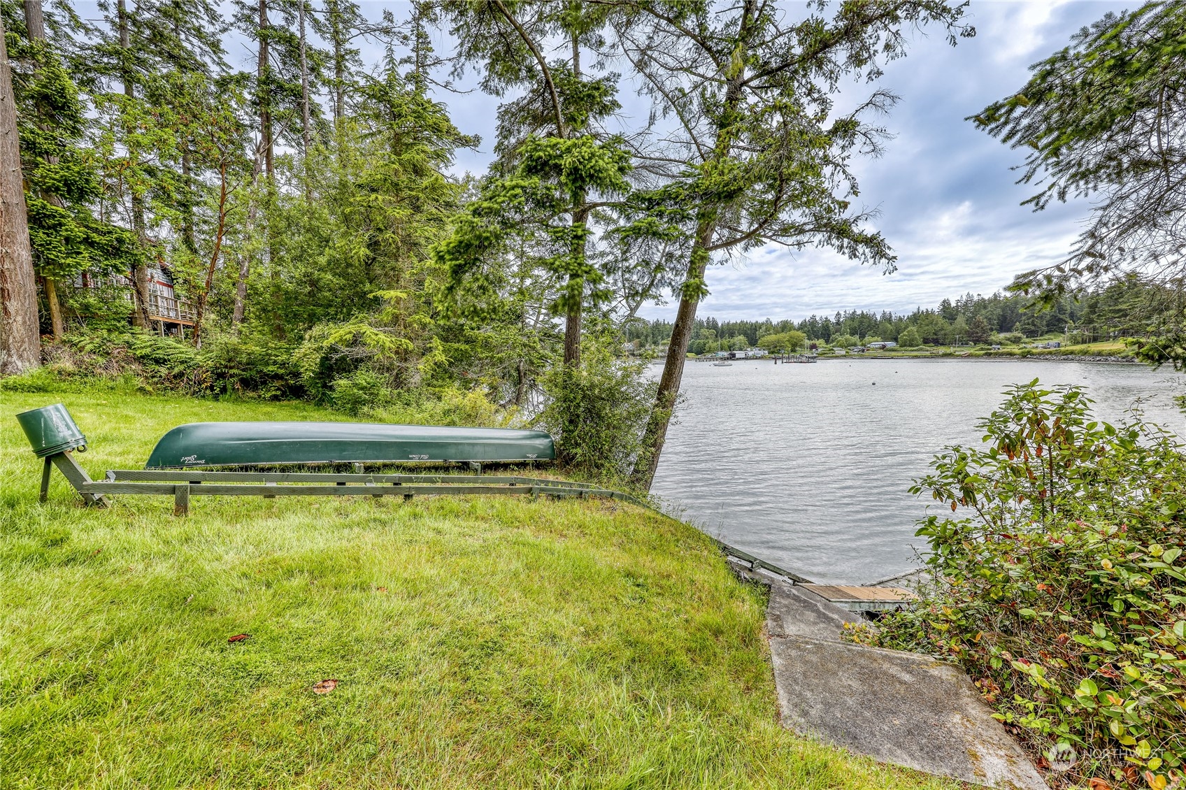 1511 Griffith Point Road Nordland, WA 98358 - Photo 2 of 40 a view of a swimming pool with a lake view