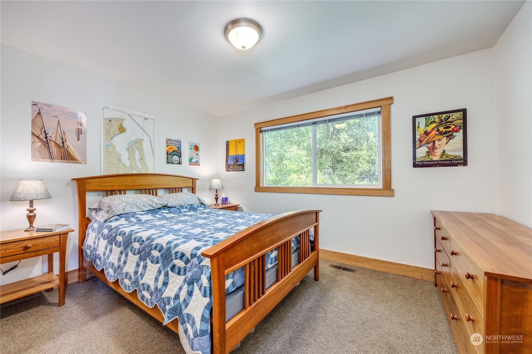1511 Griffith Point Road Nordland, WA 98358 - Photo 22 of 40 a bedroom with a bed and a window