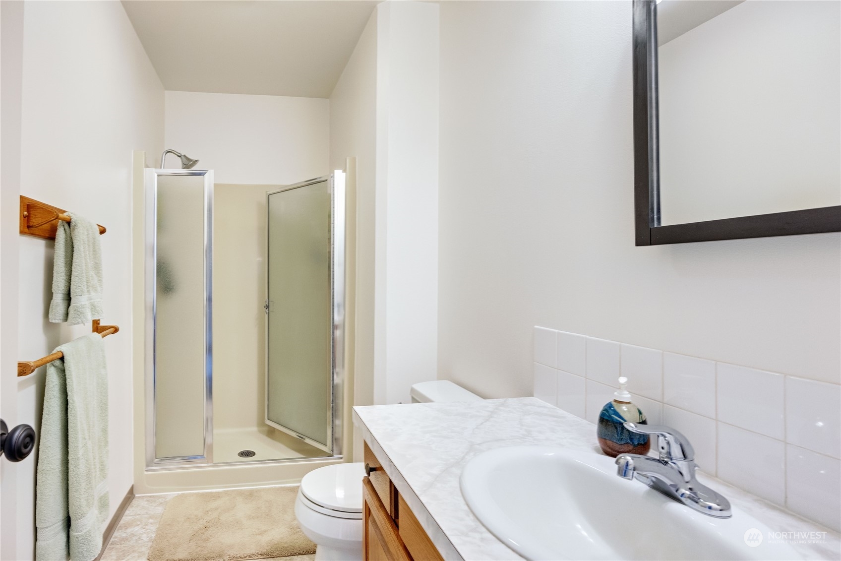 1511 Griffith Point Road Nordland, WA 98358 - Photo 23 of 40 a bathroom with a sink a toilet and shower
