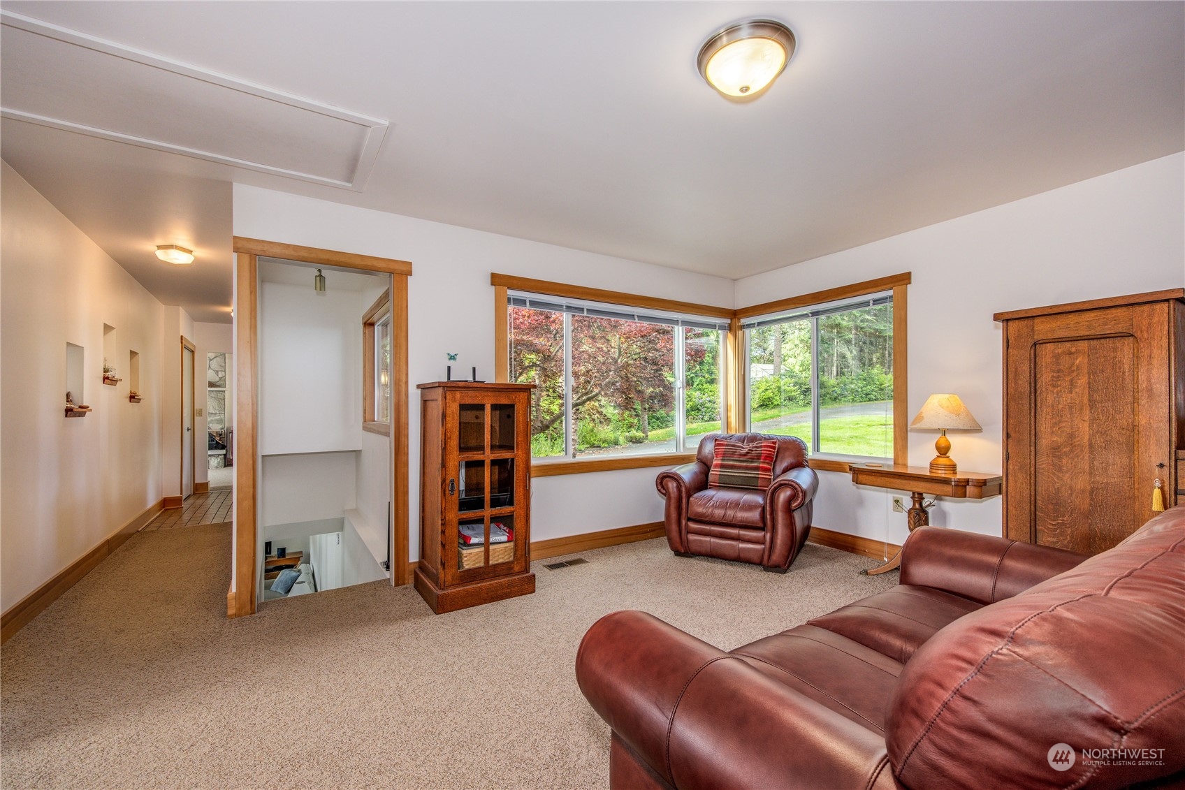1511 Griffith Point Road Nordland, WA 98358 - Photo 24 of 40 a living room with furniture and a large window