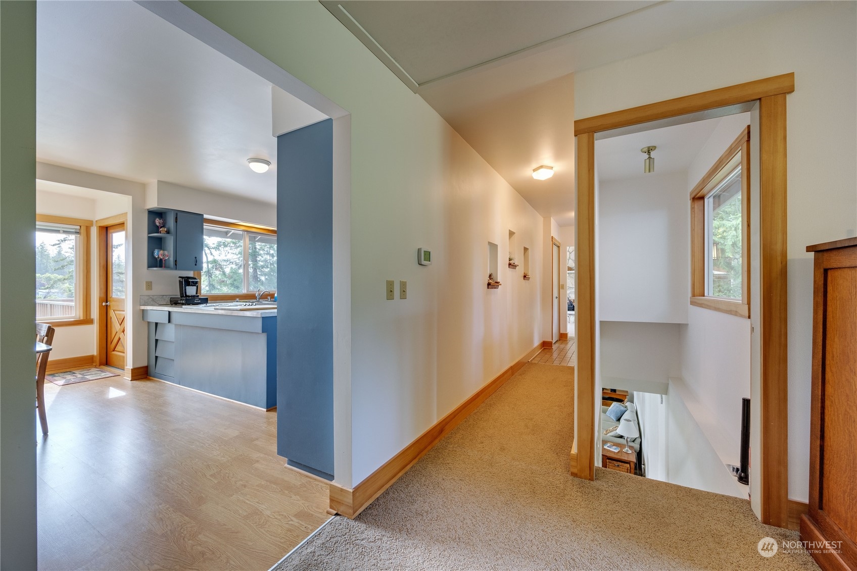 1511 Griffith Point Road Nordland, WA 98358 - Photo 25 of 40 a view of a hallway with wooden floor and a living room