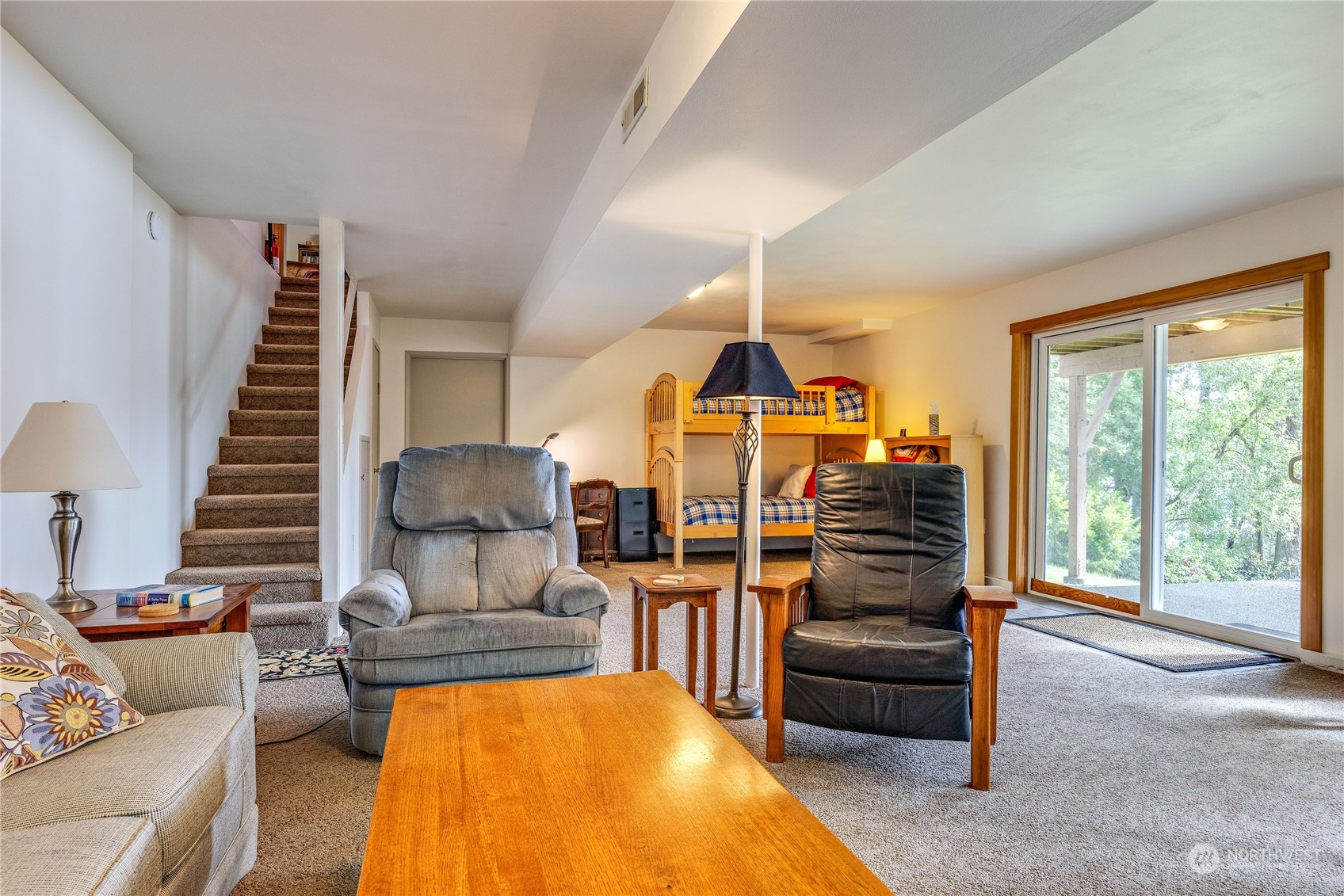 1511 Griffith Point Road Nordland, WA 98358 - Photo 28 of 40 a view of a livingroom with furniture and a floor to ceiling window