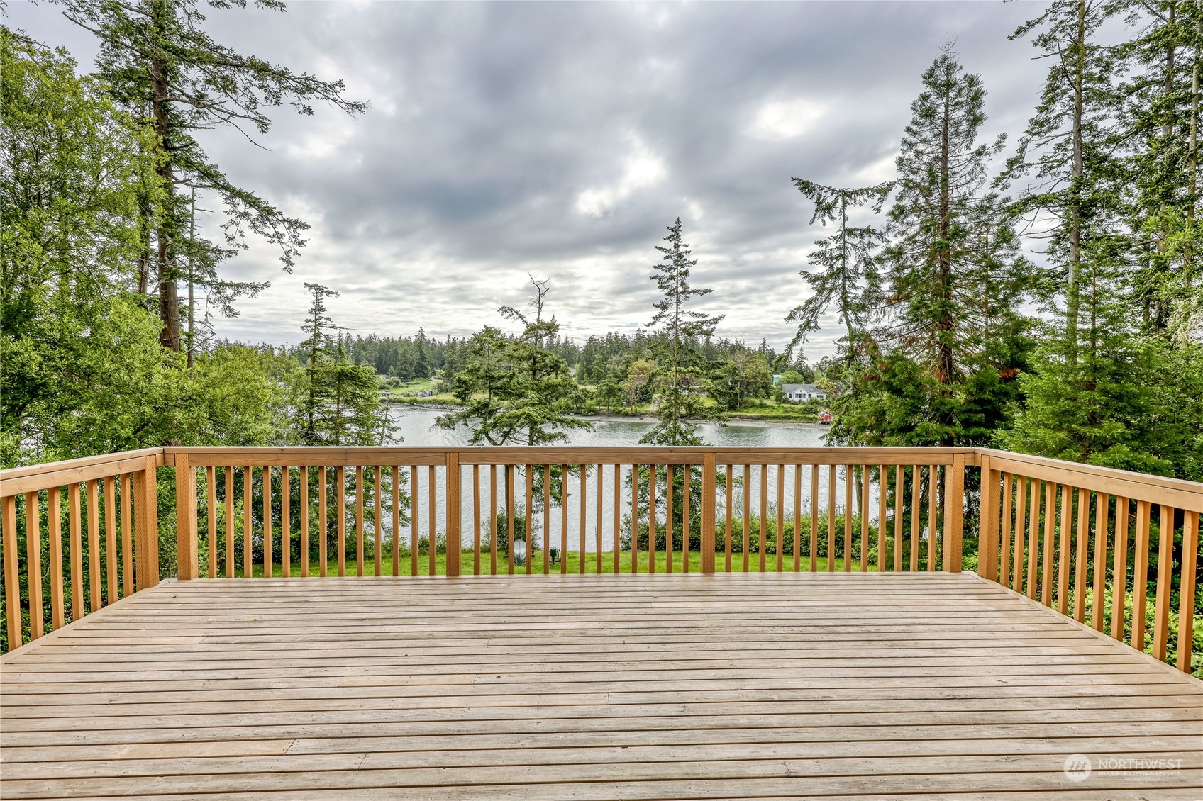 1511 Griffith Point Road Nordland, WA 98358 - Photo 31 of 40 a balcony with wooden floor and fence