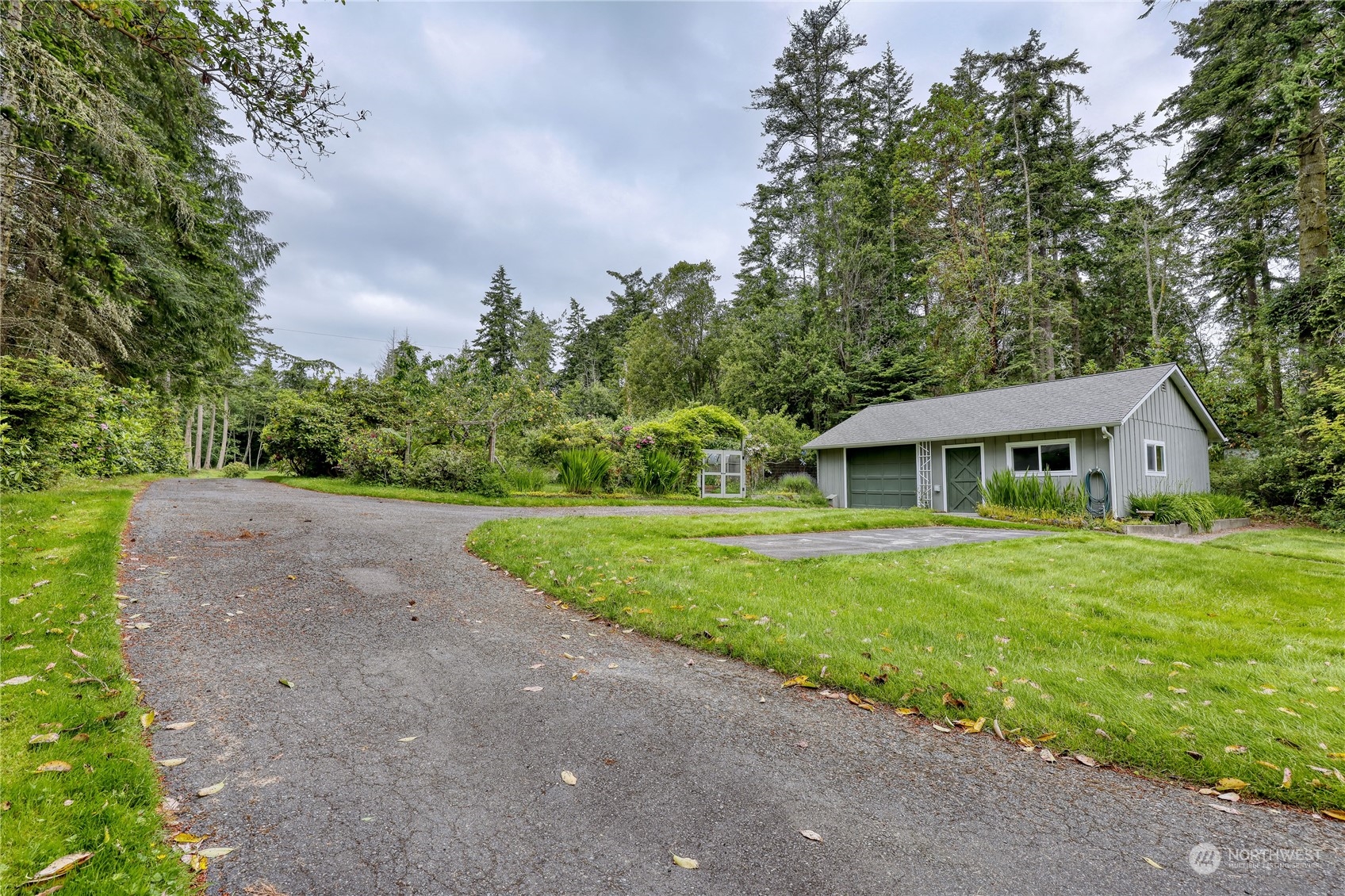1511 Griffith Point Road Nordland, WA 98358 - Photo 36 of 40 a front view of a house with a garden