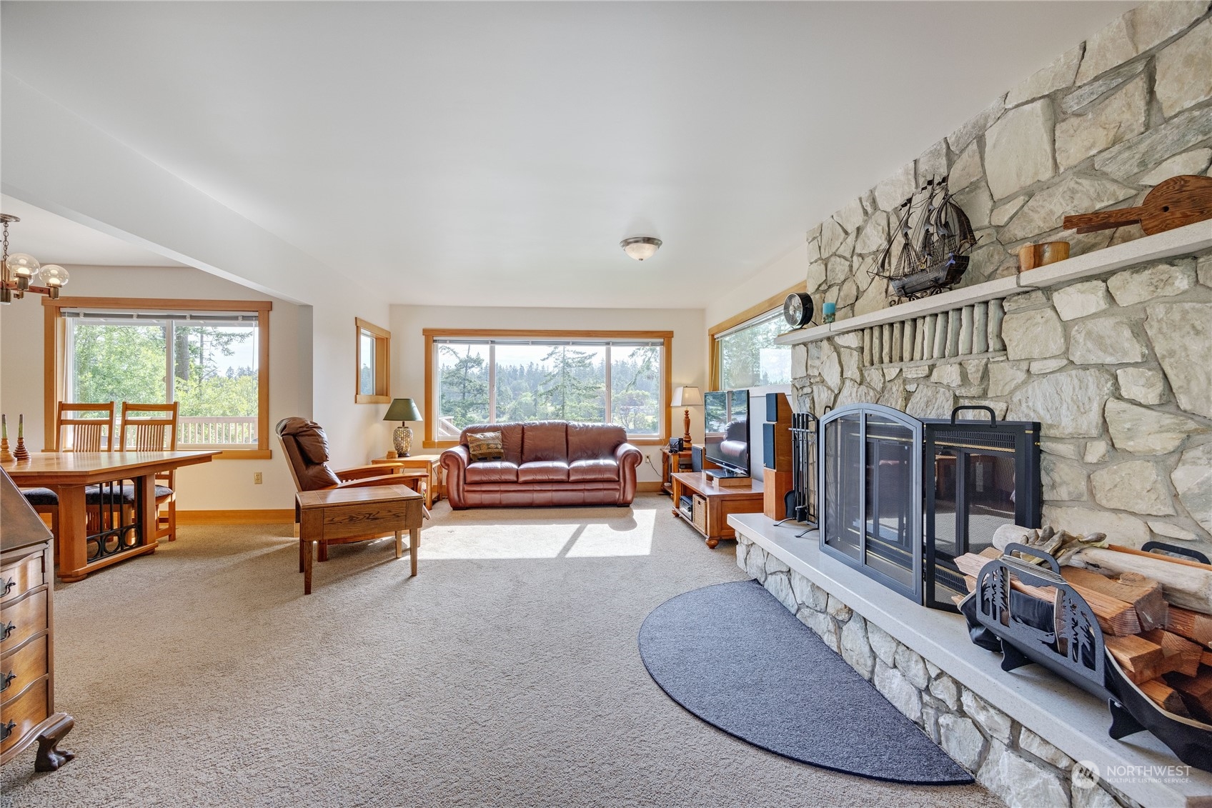 1511 Griffith Point Road Nordland, WA 98358 - Photo 9 of 40 a living room with furniture and a dining table