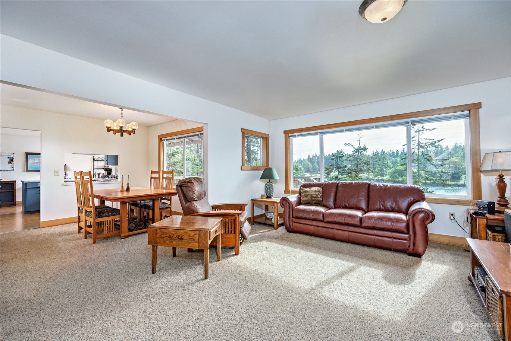 1511 Griffith Point Road Nordland, WA 98358 - Photo 10 of 40 a living room with furniture and a large window