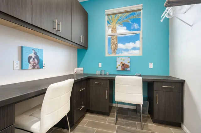 a workspace with furniture and window