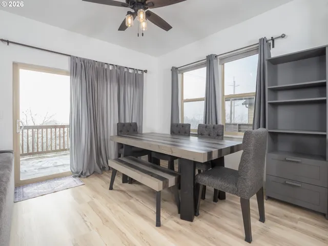 a bedroom with a bed a fireplace and a television