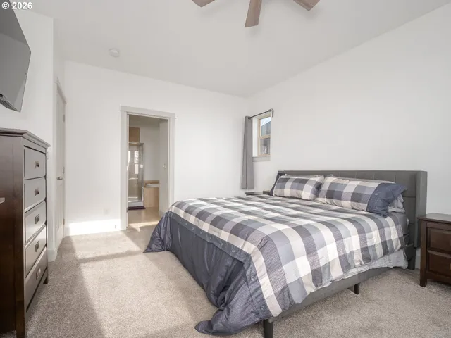 a spacious bathroom with a bathtub shower sink mirror and