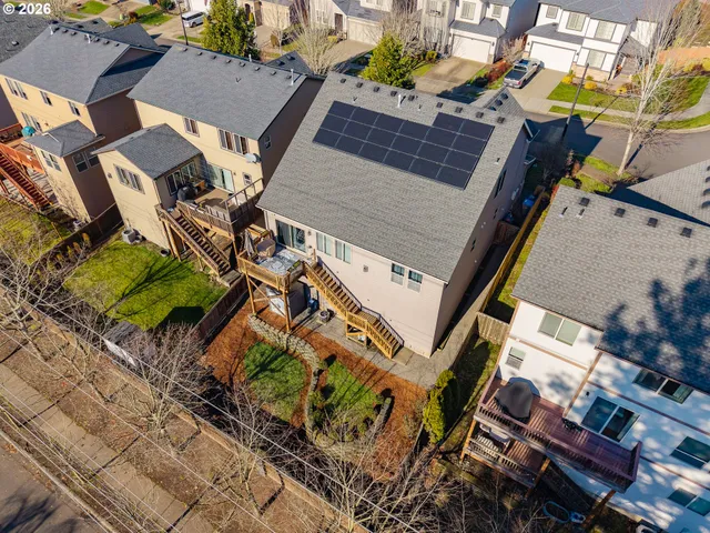 a view of a house with wooden fence