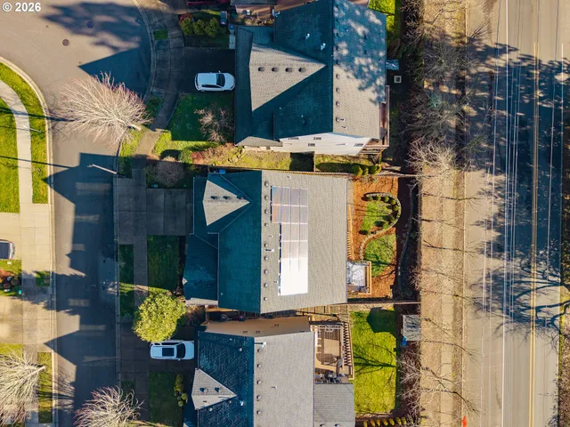 a view of a swimming pool with a patio and a garden