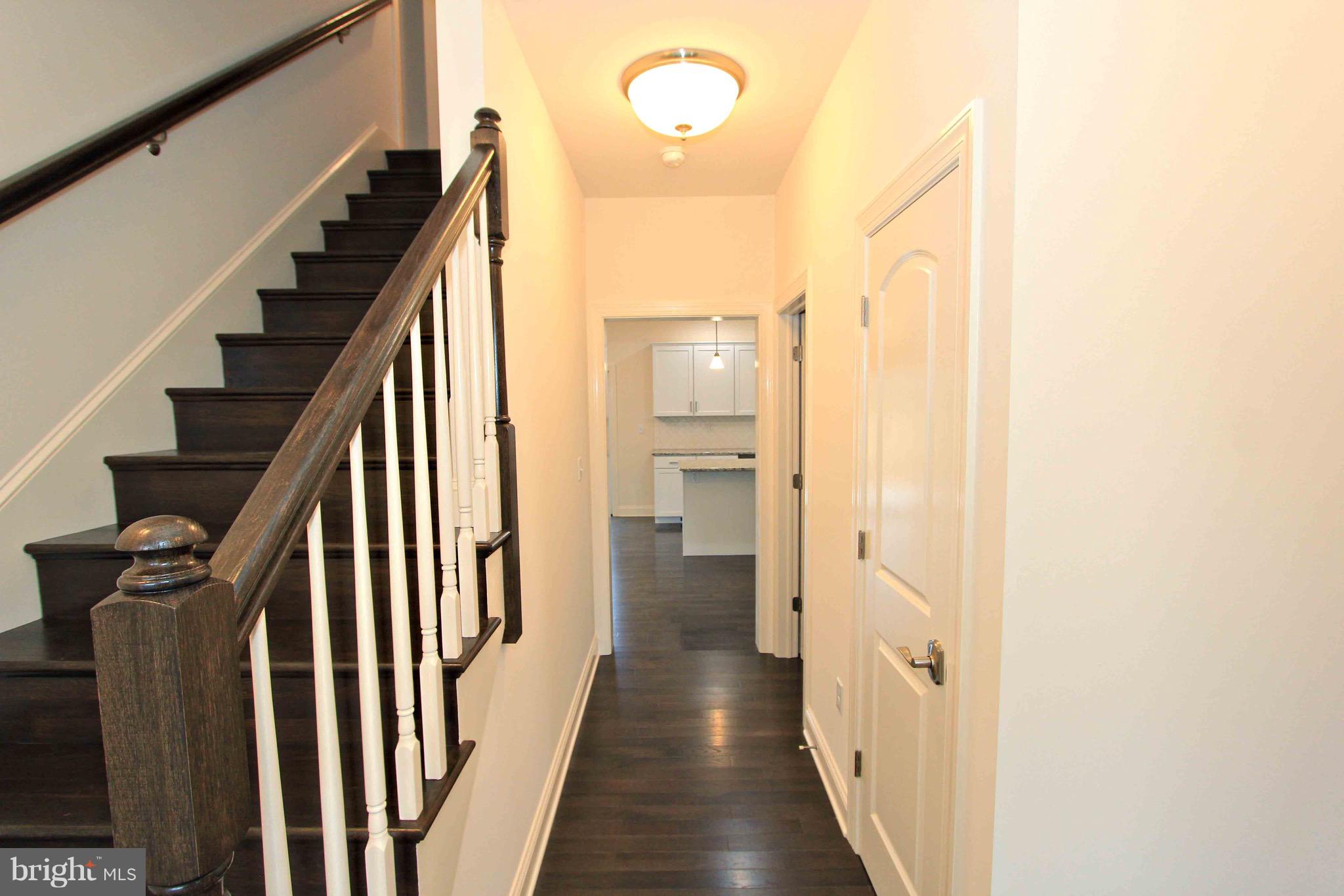 2455 Baker Road York, PA 17408 - Photo 13 of 54 Staircase and hall to Hall Closet, PR and Kitchen