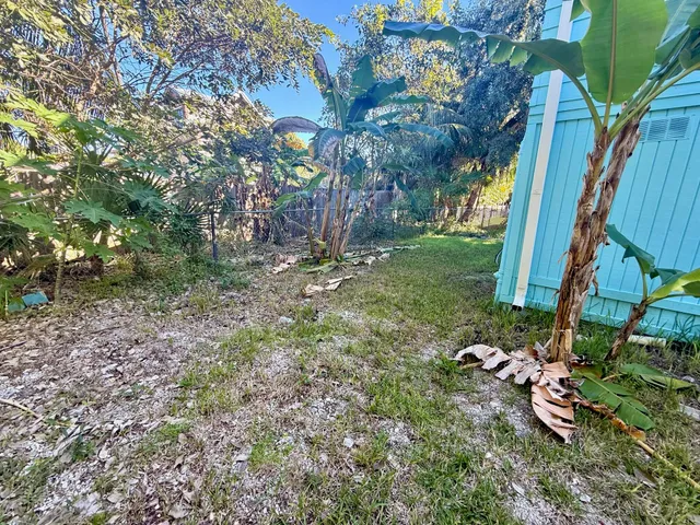 a backyard of a house with lots of green space