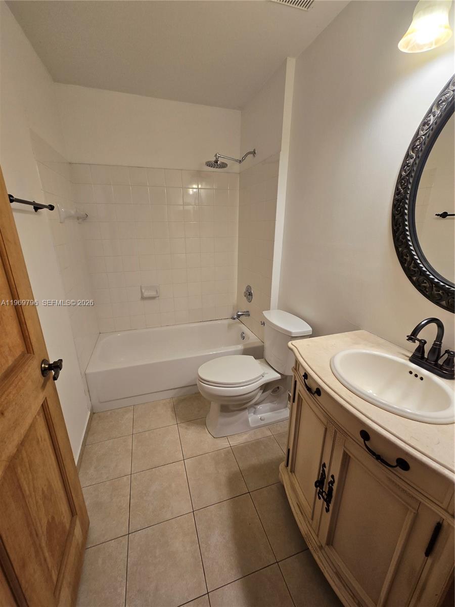 14611 Balgowan Road, Unit 2041 Miami Lakes, FL 33016 - Photo 14 of 22 a bathroom with a sink a toilet and shower