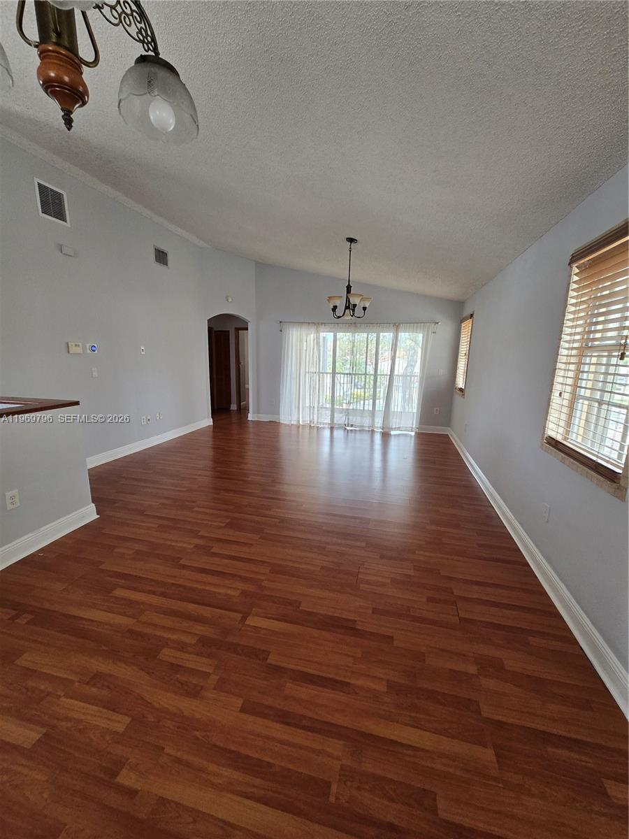 14611 Balgowan Road, Unit 2041 Miami Lakes, FL 33016 - Photo 4 of 22 a view of empty room with wooden floor
