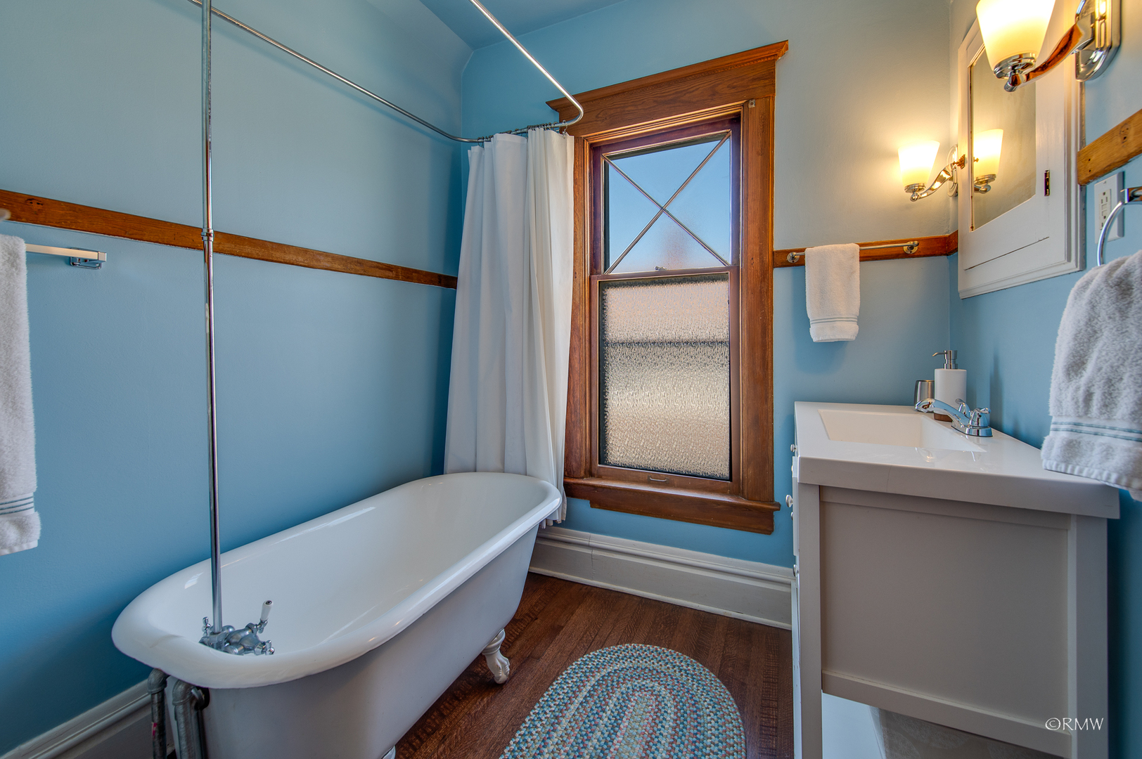 414 North Spring Street Elgin, IL 60120 - Photo 32 of 51 a bathroom with a sink and a mirror