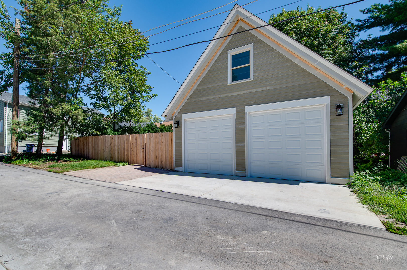 414 North Spring Street Elgin, IL 60120 - Photo 50 of 51 a front view of a house with garage and plants