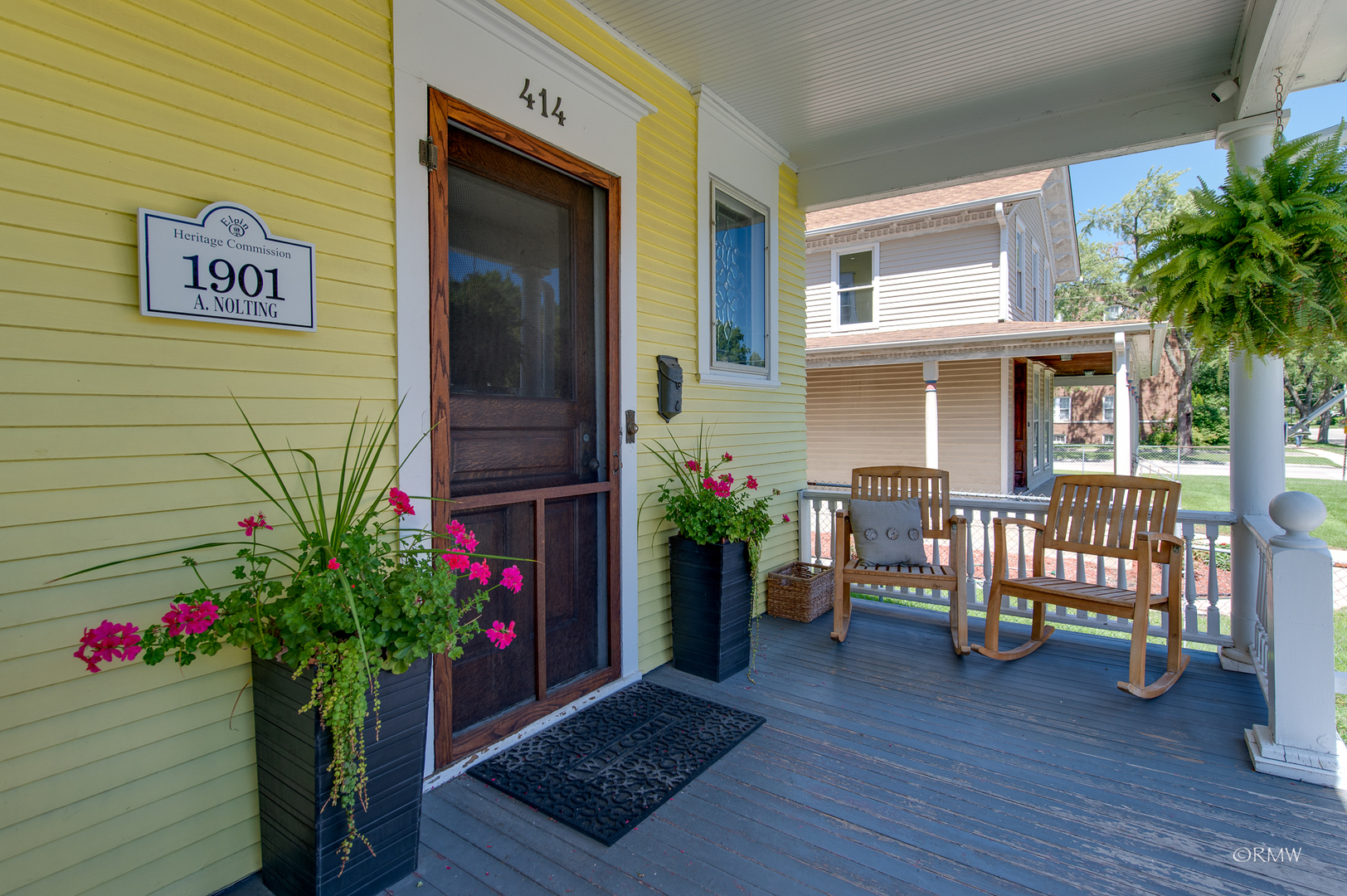 414 North Spring Street Elgin, IL 60120 - Photo 6 of 51 a potted plant sitting in front of a house