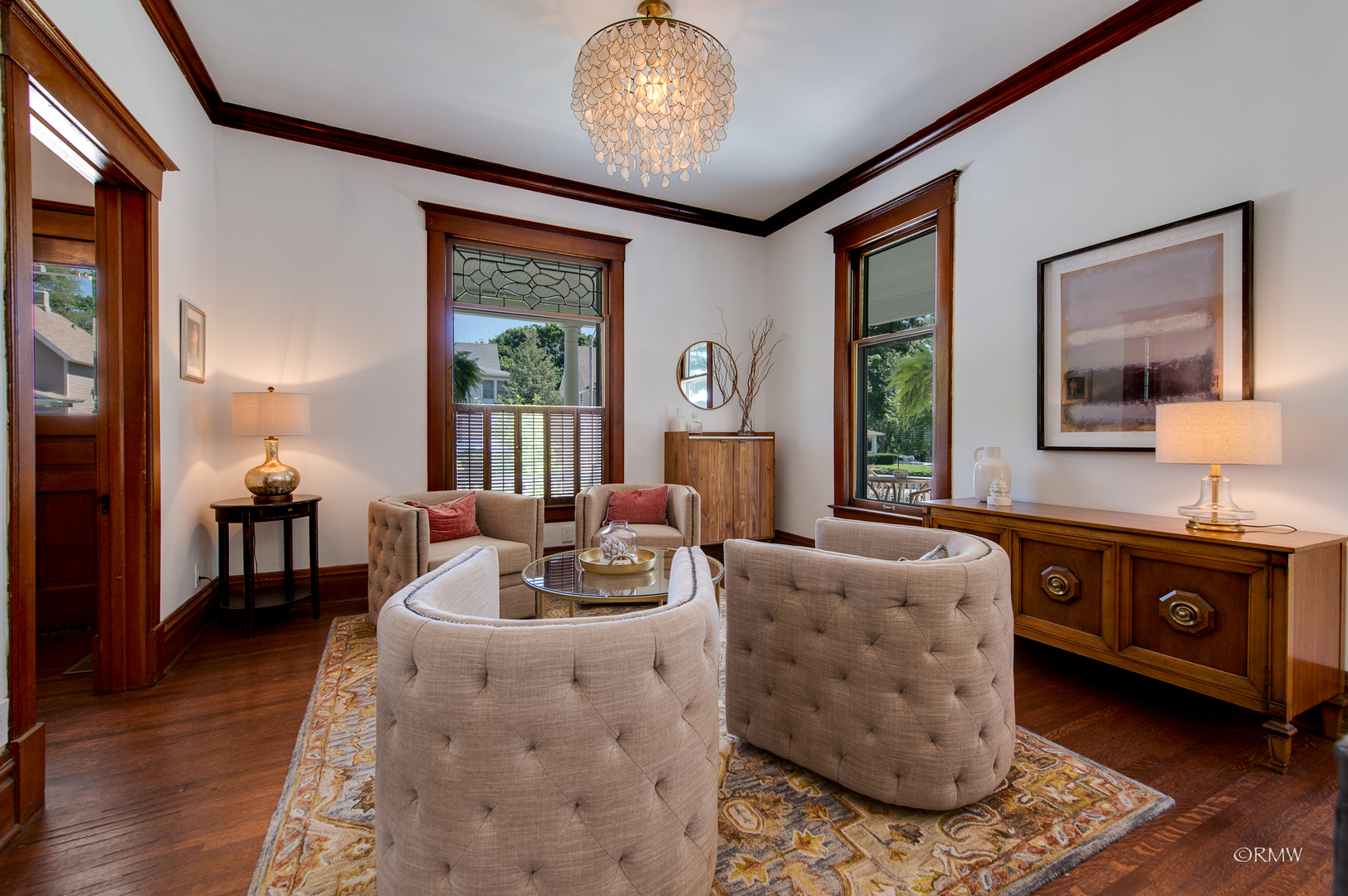 414 North Spring Street Elgin, IL 60120 - Photo 10 of 51 a living room with furniture and a chandelier