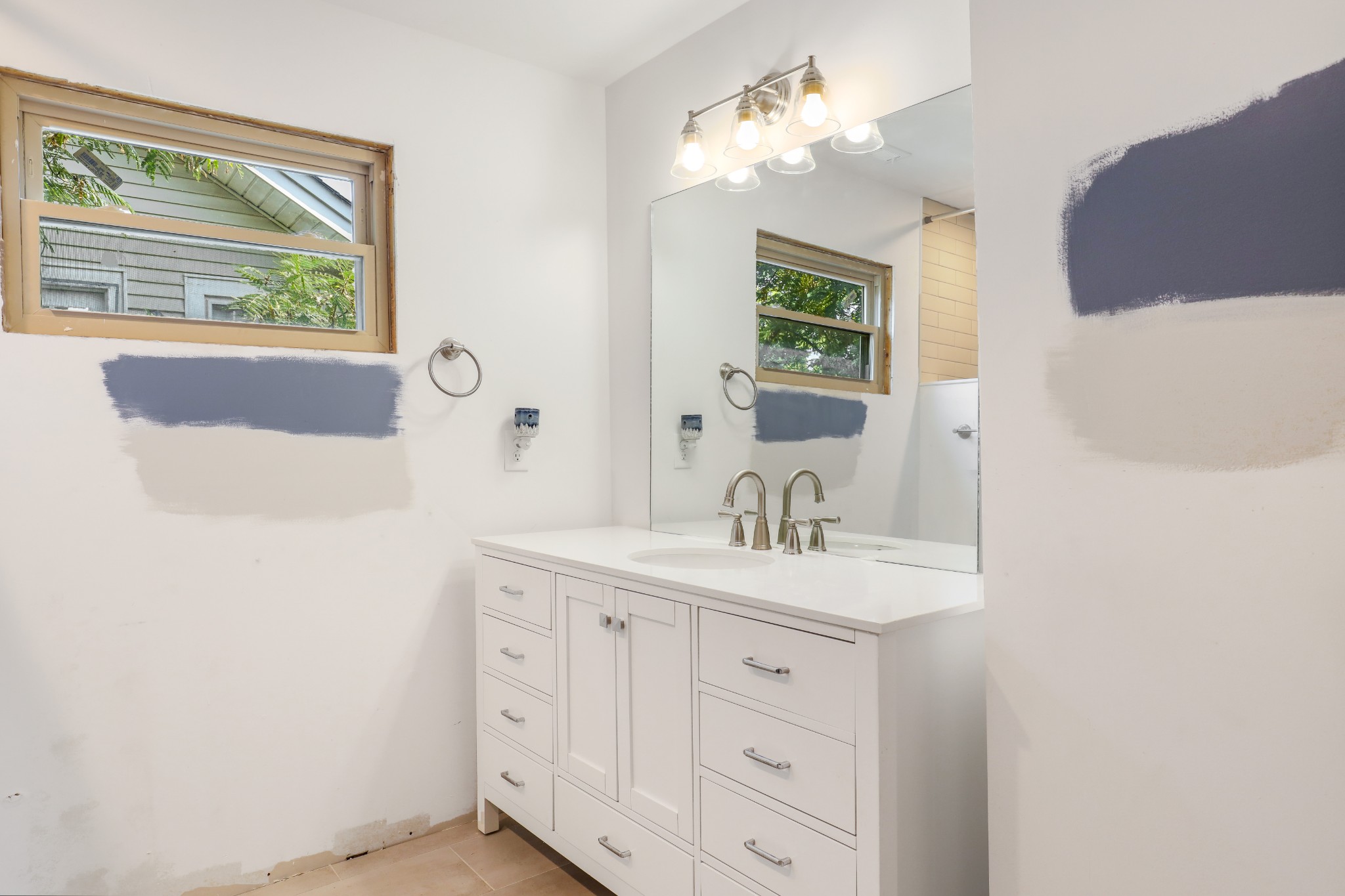 307 North Walnut Street Springfield, TN 37172 - Photo 21 of 23 a bathroom with a sink a large mirror and a window