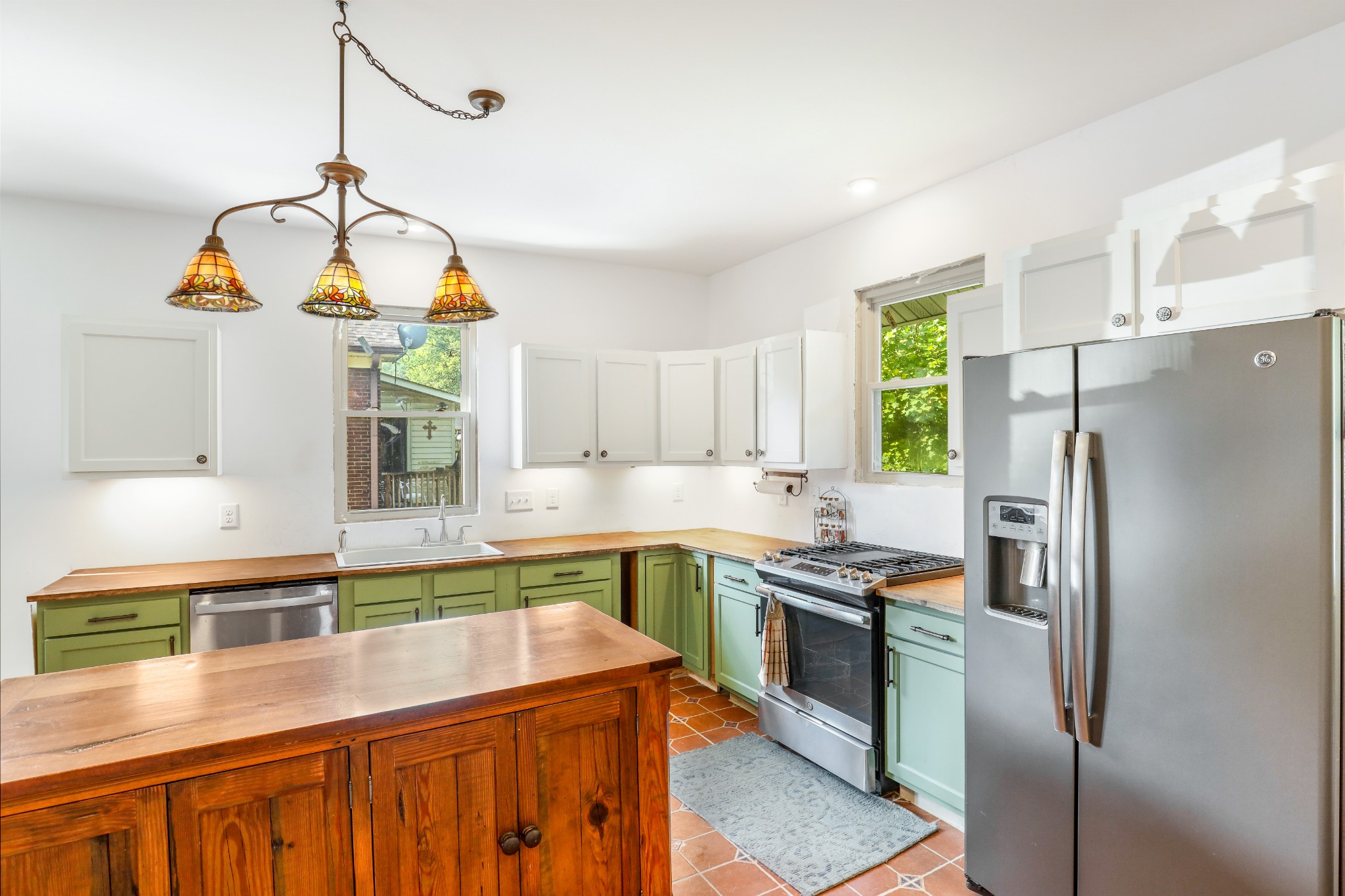 307 North Walnut Street Springfield, TN 37172 - Photo 5 of 23 a kitchen with stainless steel appliances granite countertop a sink a stove and refrigerator