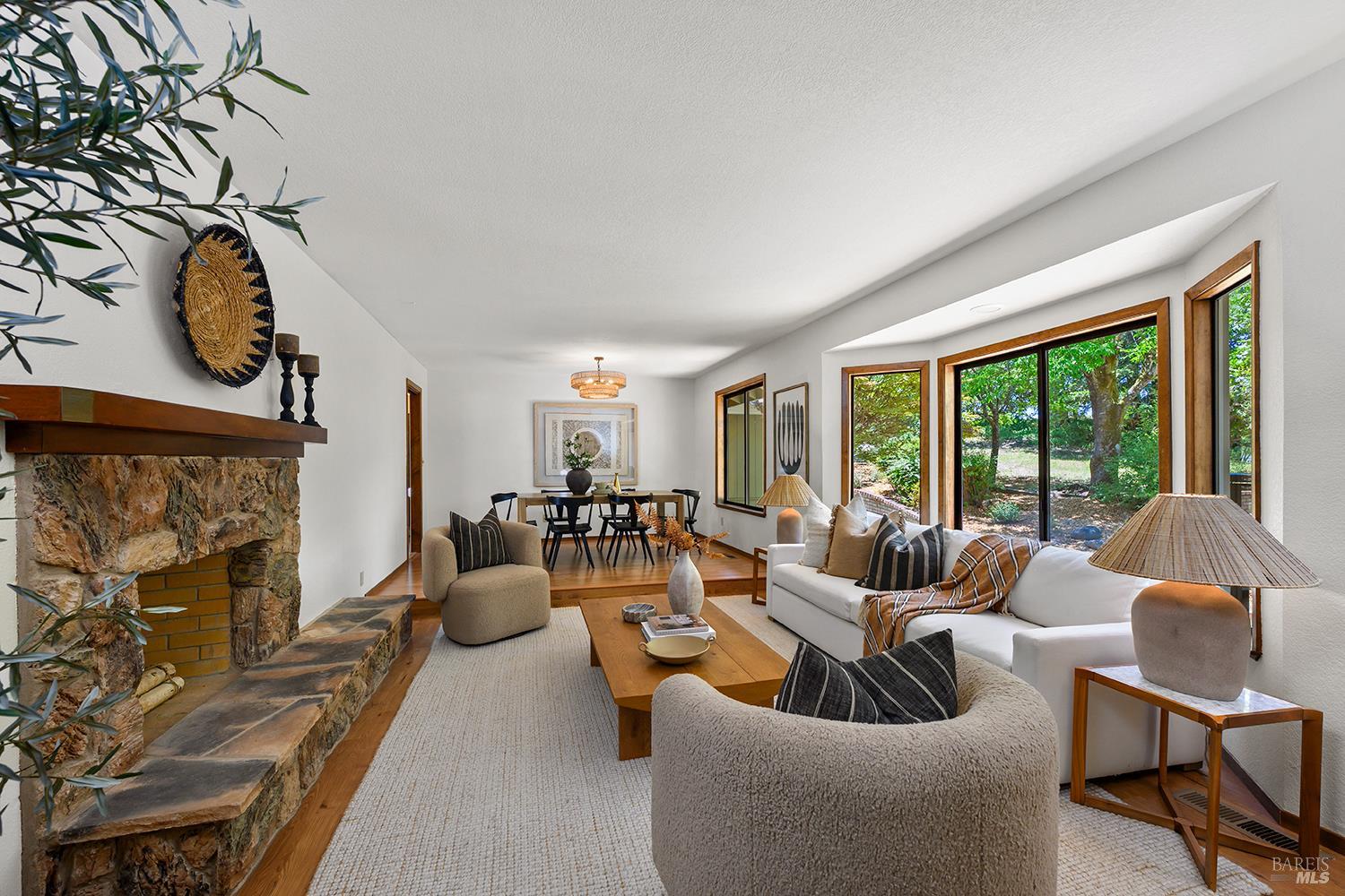 7595 Giusti Road Forestville, CA 95436 - Photo 8 of 41 a living room with furniture and a fireplace
