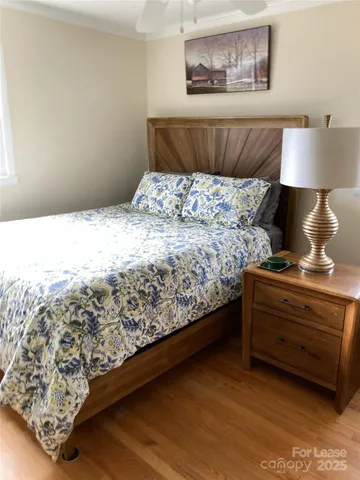 a view of room with wooden floor