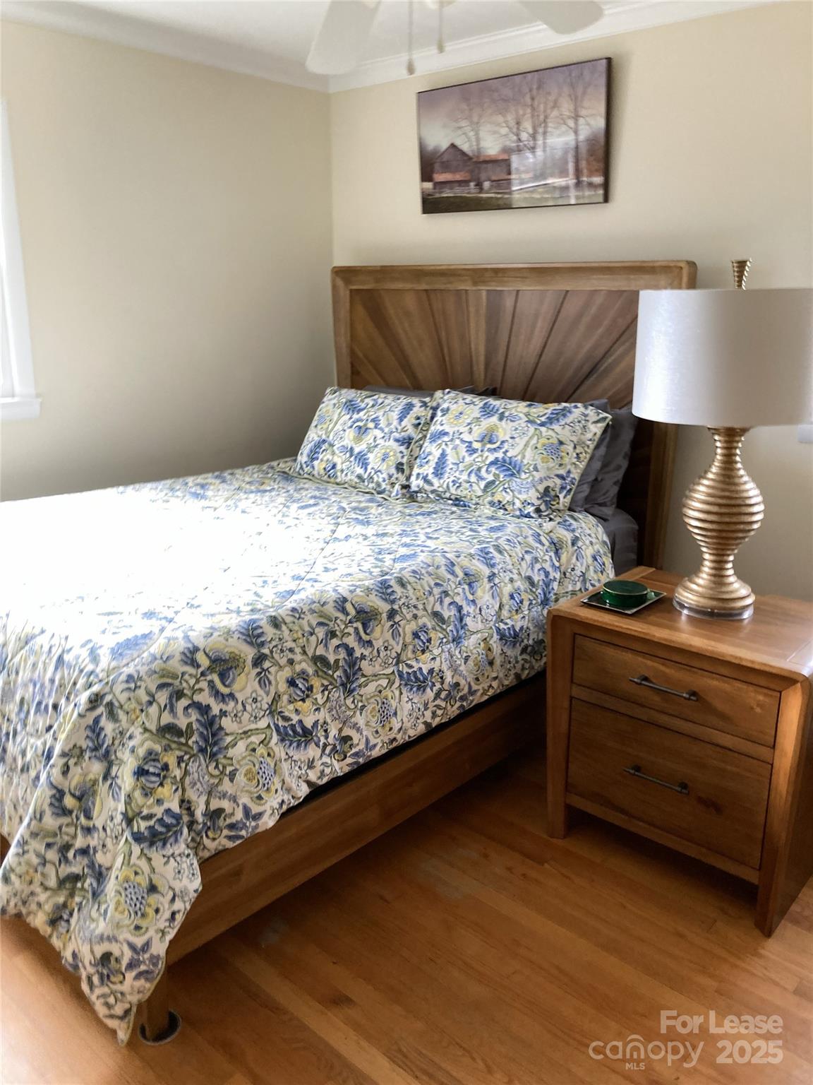 179 Rutledge Road Fletcher, NC 28732 - Photo 19 of 28 a bed sitting in a bedroom next to a lamp