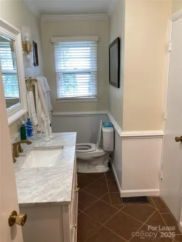 a bathroom with sink and a mirror
