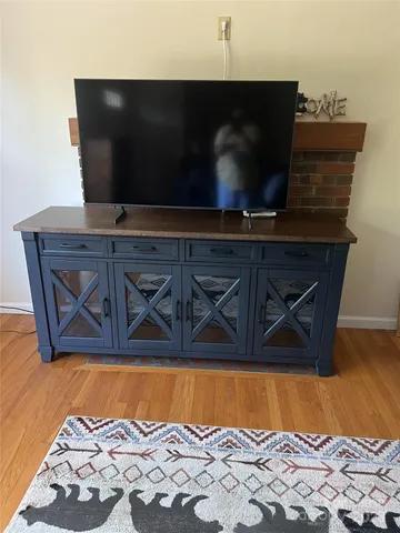 a living room with a wooden floor