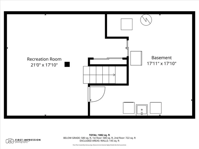 a picture of a bench in front of a wall