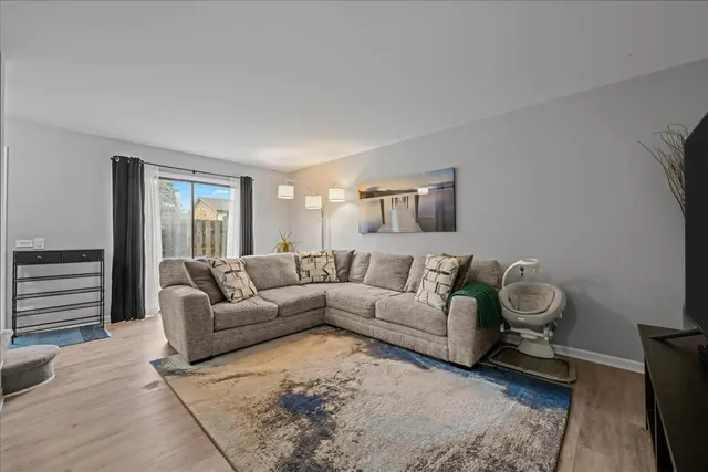 a living room with a couch and a window