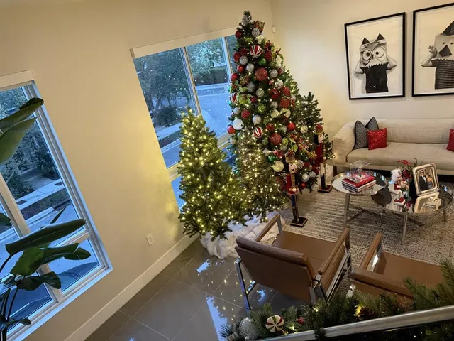an outdoor living room with furniture and flowers