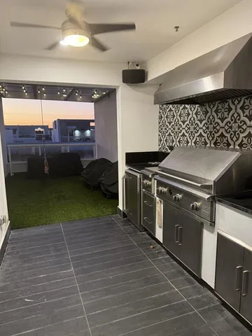 a kitchen with a stove and a microwave