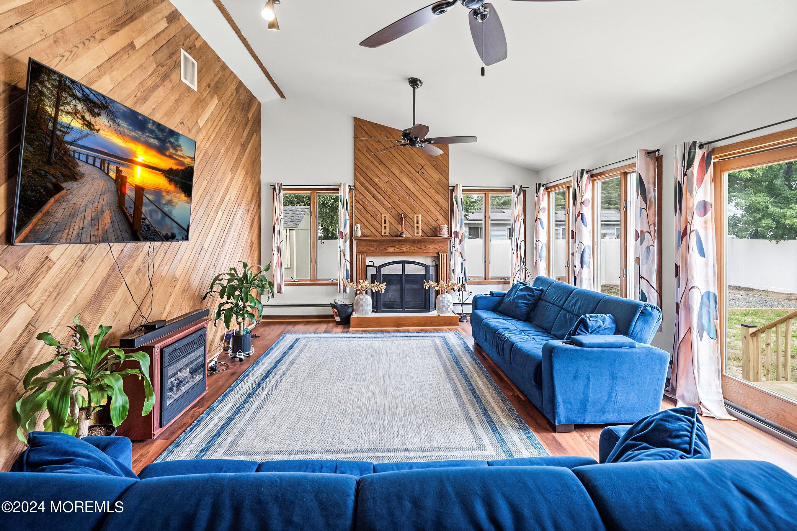 34 Maple Street Waretown, NJ 08758 - Photo 23 of 36 a living room with furniture and a fireplace