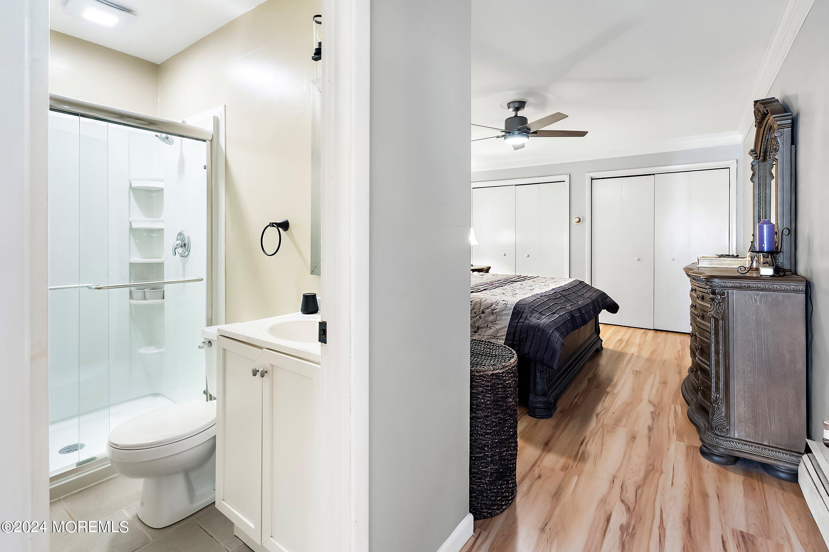 34 Maple Street Waretown, NJ 08758 - Photo 26 of 36 a bathroom with a toilet a sink and shower