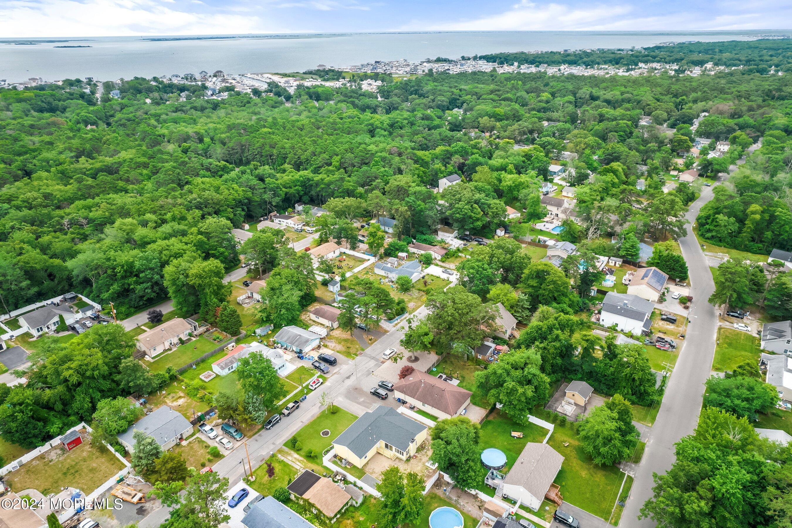 34 Maple Street Waretown, NJ 08758 - Photo 35 of 36 an aerial view of a house with a yard