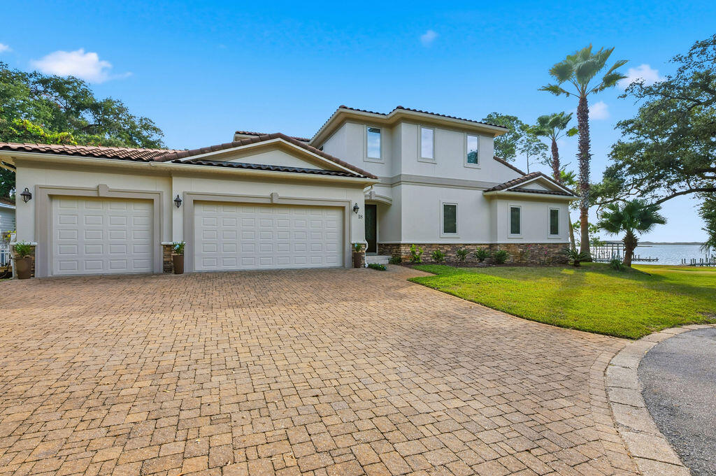 18 Kimbrough Road Mary Esther, FL 32569 - Photo 1 of 89 a front view of a house with a yard and garage
