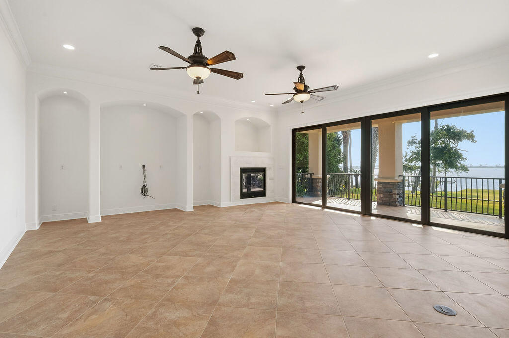 18 Kimbrough Road Mary Esther, FL 32569 - Photo 13 of 96 a view of an empty room with a ceiling fan and window