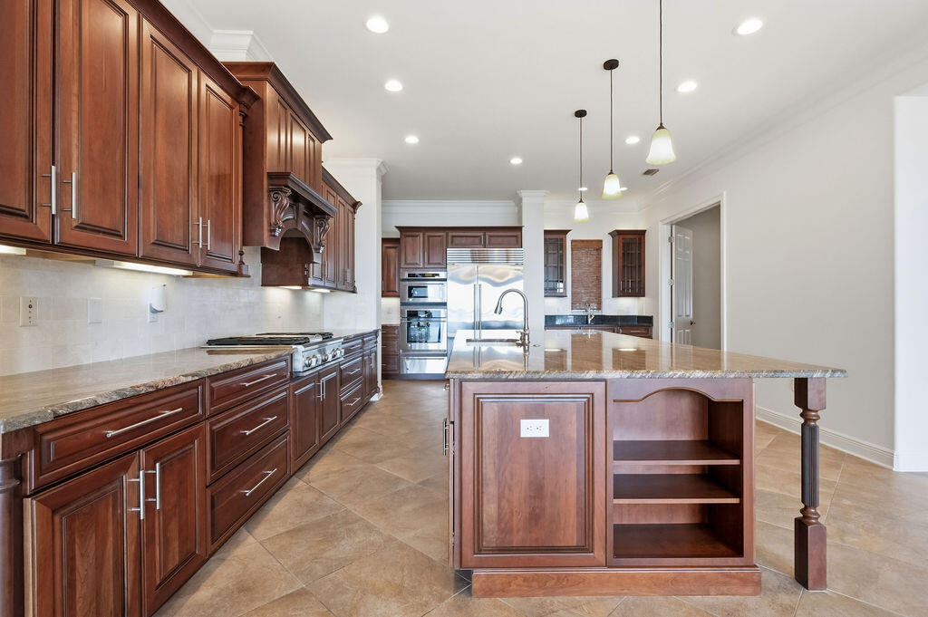 18 Kimbrough Road Mary Esther, FL 32569 - Photo 19 of 89 a kitchen with kitchen island granite countertop a stove and a refrigerator
