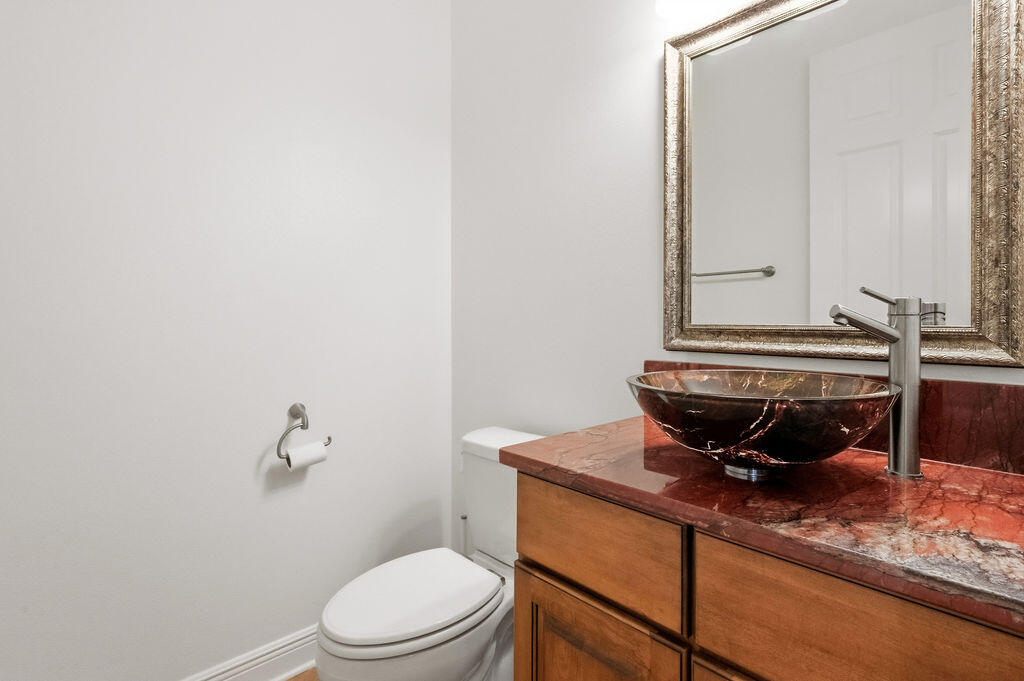 18 Kimbrough Road Mary Esther, FL 32569 - Photo 24 of 89 a bathroom with a toilet a sink and mirror
