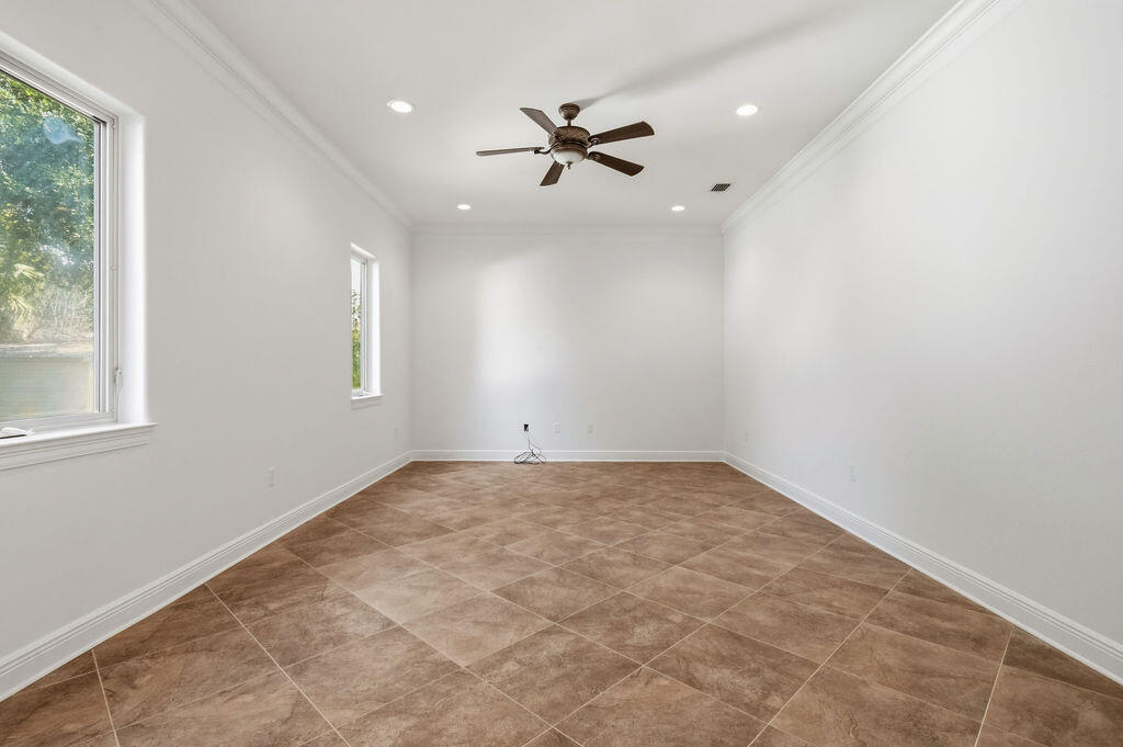 18 Kimbrough Road Mary Esther, FL 32569 - Photo 25 of 96 an empty room with a window and a ceiling fan