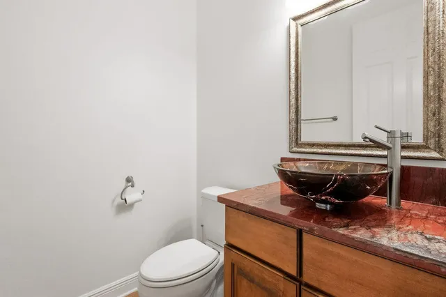 a view of a room with a ceiling fan and window