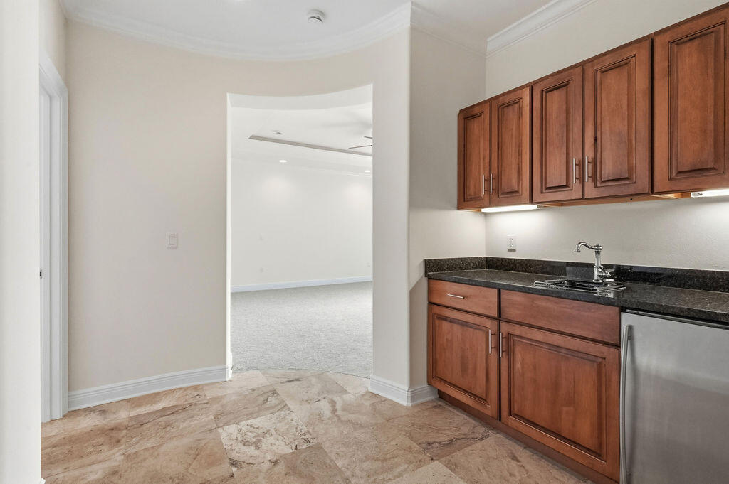 18 Kimbrough Road Mary Esther, FL 32569 - Photo 28 of 89 a kitchen with granite countertop a refrigerator and a sink