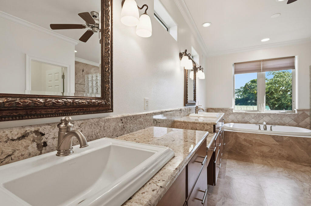 18 Kimbrough Road Mary Esther, FL 32569 - Photo 39 of 89 a bathroom with a granite countertop sink and a large mirror