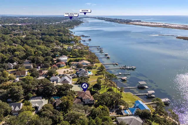 a living room with furniture fireplace and a large window